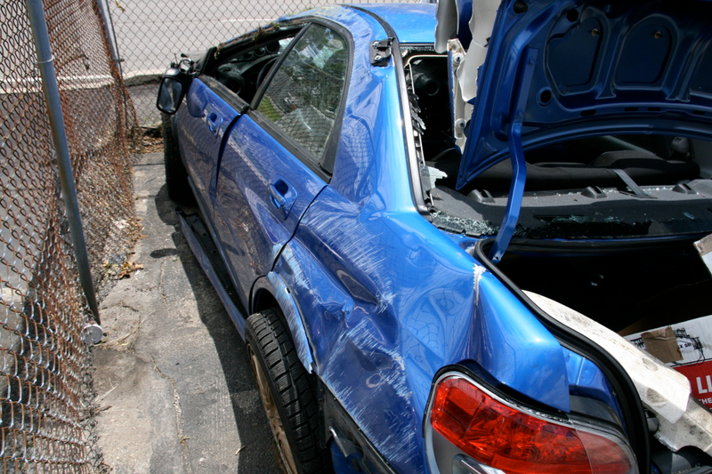 Illustration for article titled Subaru STI Hits Two Trees At Speed, Flips Twice, Everyone Survives!